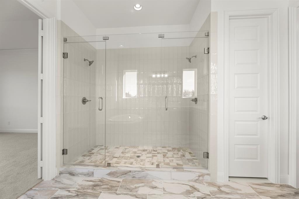 2006 Wickersham Road Rockwall, TX 75087 - Photo 18 of 33 a bathroom with a shower and a sink