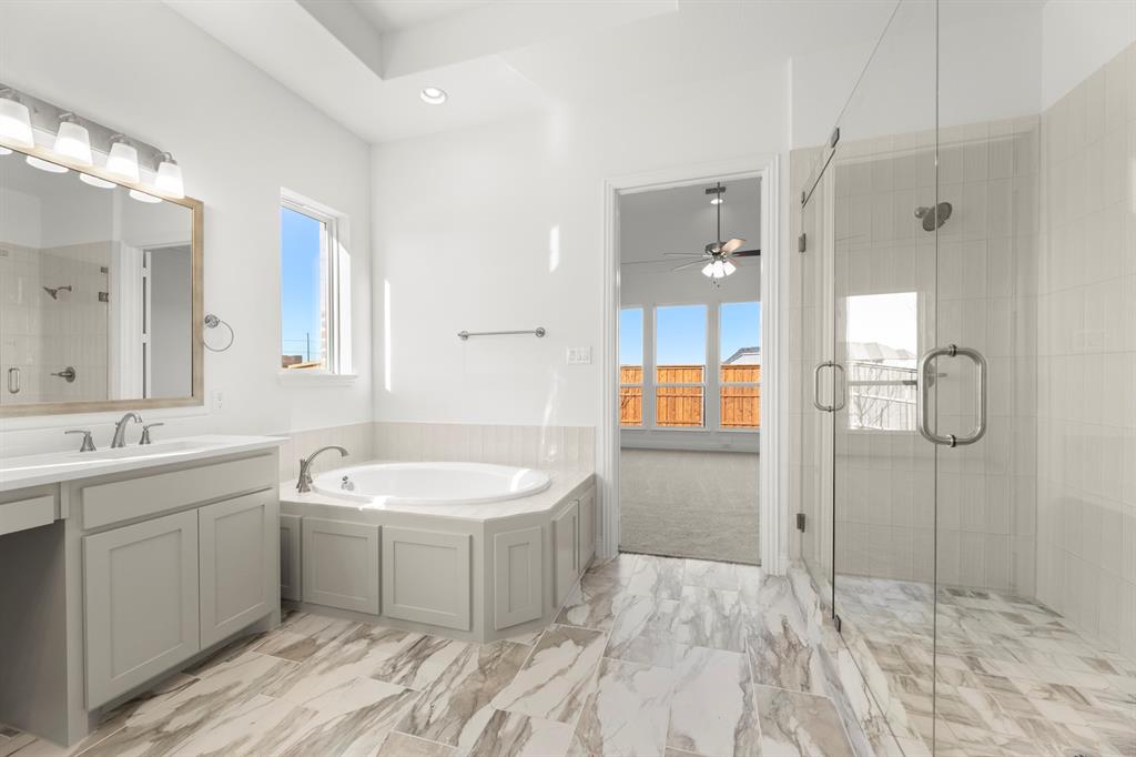 2006 Wickersham Road Rockwall, TX 75087 - Photo 20 of 33 a spacious bathroom with a double vanity sink mirror and shower