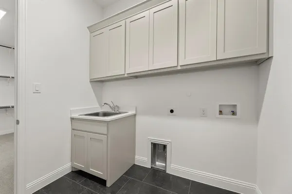 a utility room with cabinets