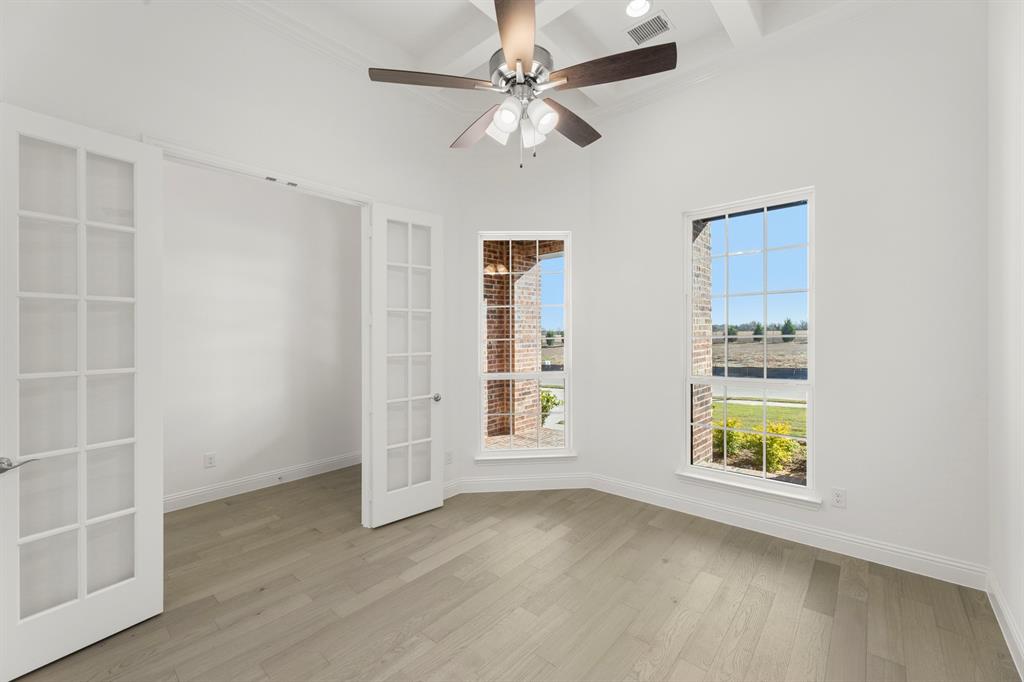 2006 Wickersham Road Rockwall, TX 75087 - Photo 4 of 33 an empty room with windows and fan