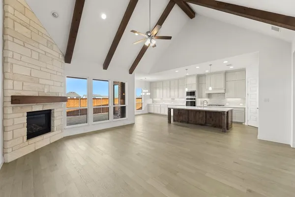 a view of a kitchen with furniture and a fireplace