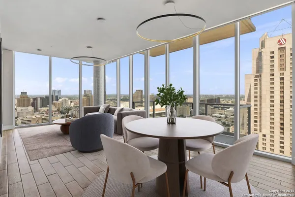 a dining room with furniture and a window