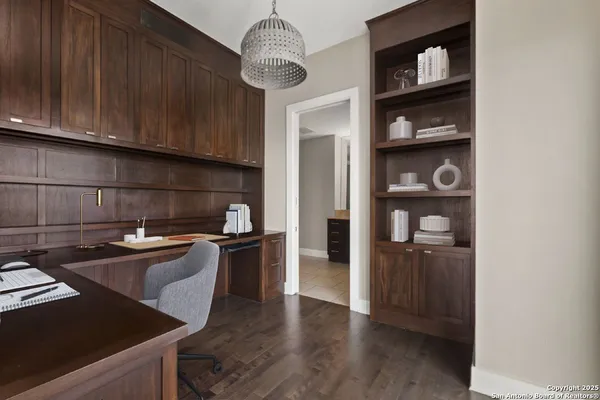 a kitchen with granite countertop stainless steel appliances and wooden cabinets