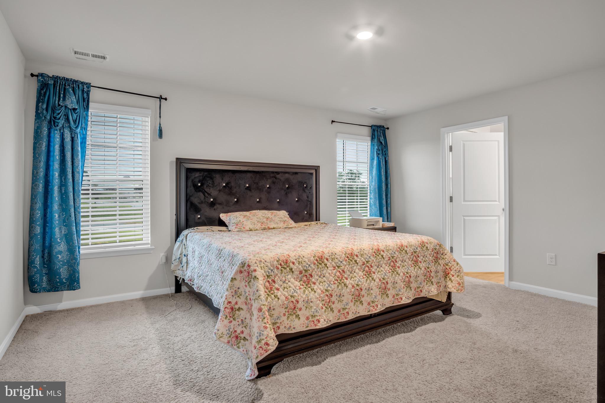 18 Smokehouse Road Carlisle, PA 17013 - Photo 15 of 33 a bed sitting in a bedroom next to a window and a chair