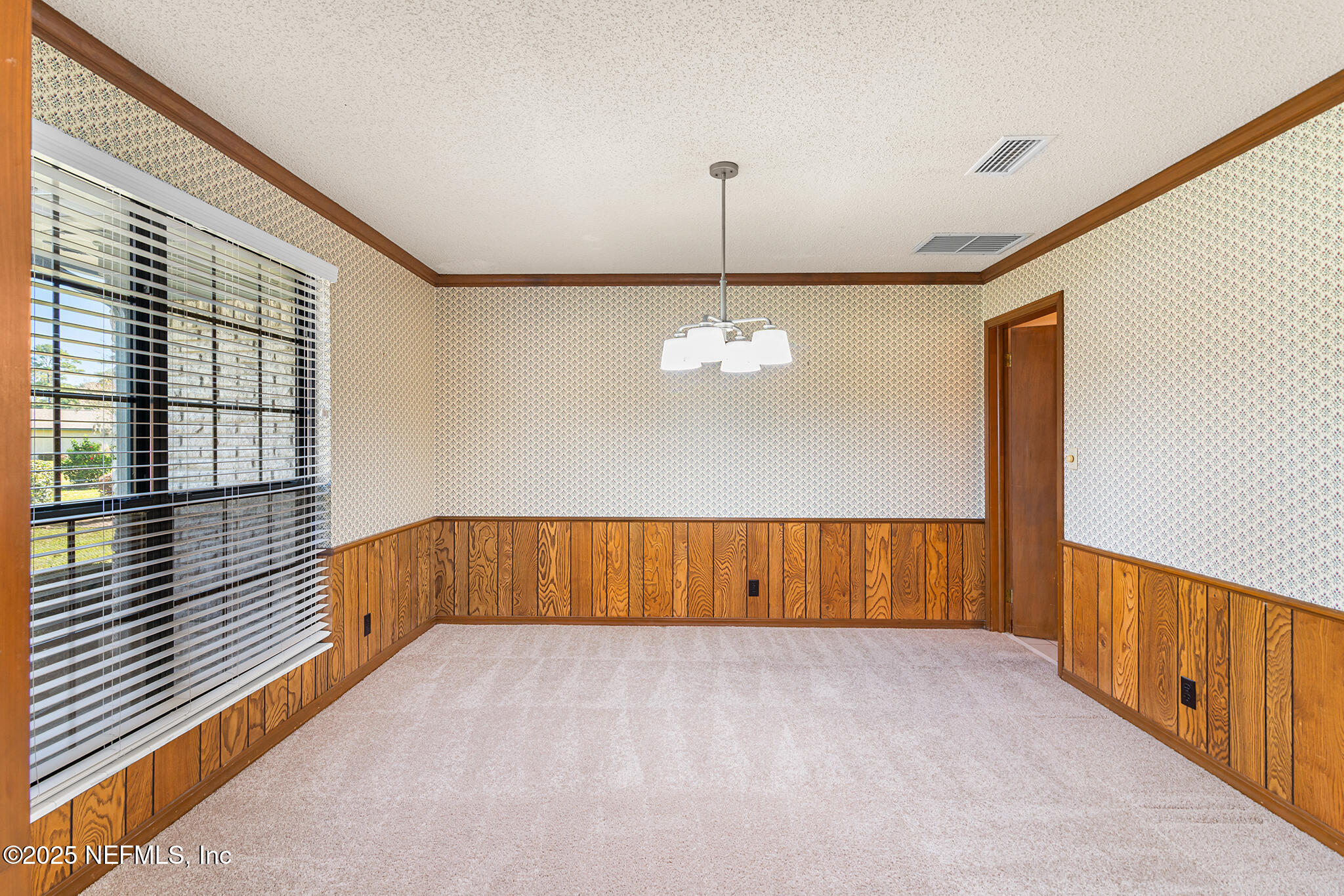12850 Deep Lagoon Place West Jacksonville, FL 32246 - Photo 13 of 51 a view of wooden floor and chandelier in a room