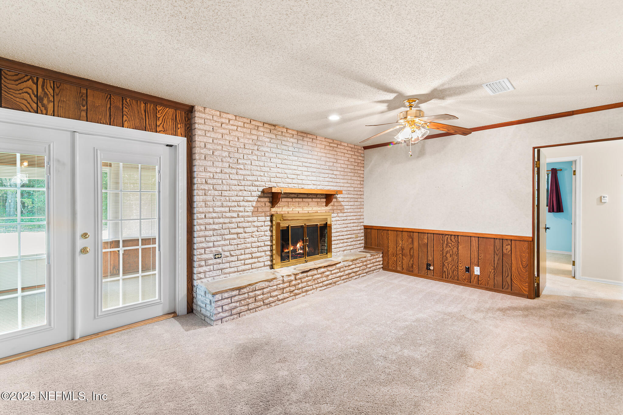 12850 Deep Lagoon Place West Jacksonville, FL 32246 - Photo 16 of 51 an empty room with windows and fireplace
