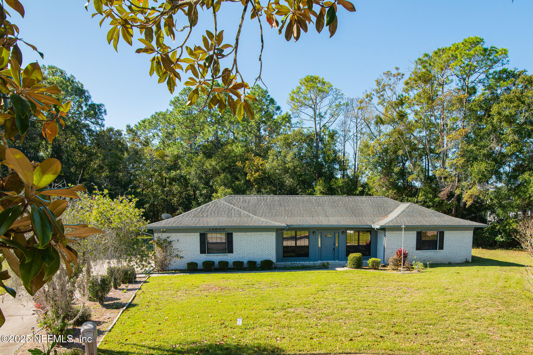 12850 Deep Lagoon Place West Jacksonville, FL 32246 - Photo 2 of 51 a view of a house with a yard