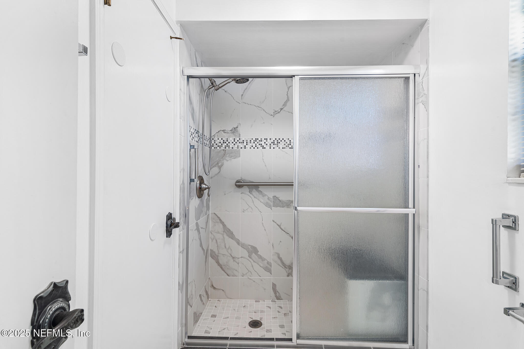 12850 Deep Lagoon Place West Jacksonville, FL 32246 - Photo 32 of 51 a bathroom with a glass shower door