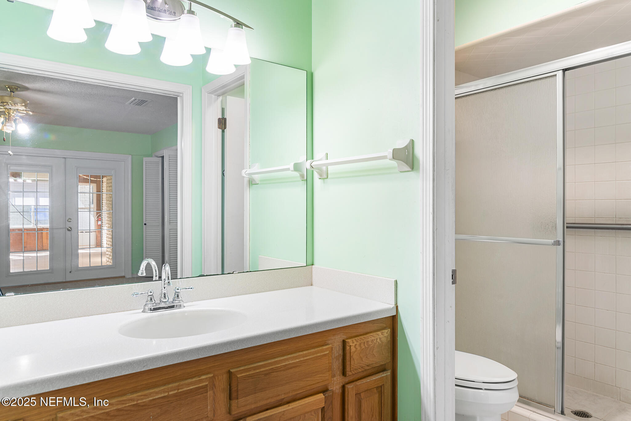 12850 Deep Lagoon Place West Jacksonville, FL 32246 - Photo 37 of 51 a bathroom with a granite countertop sink toilet and shower