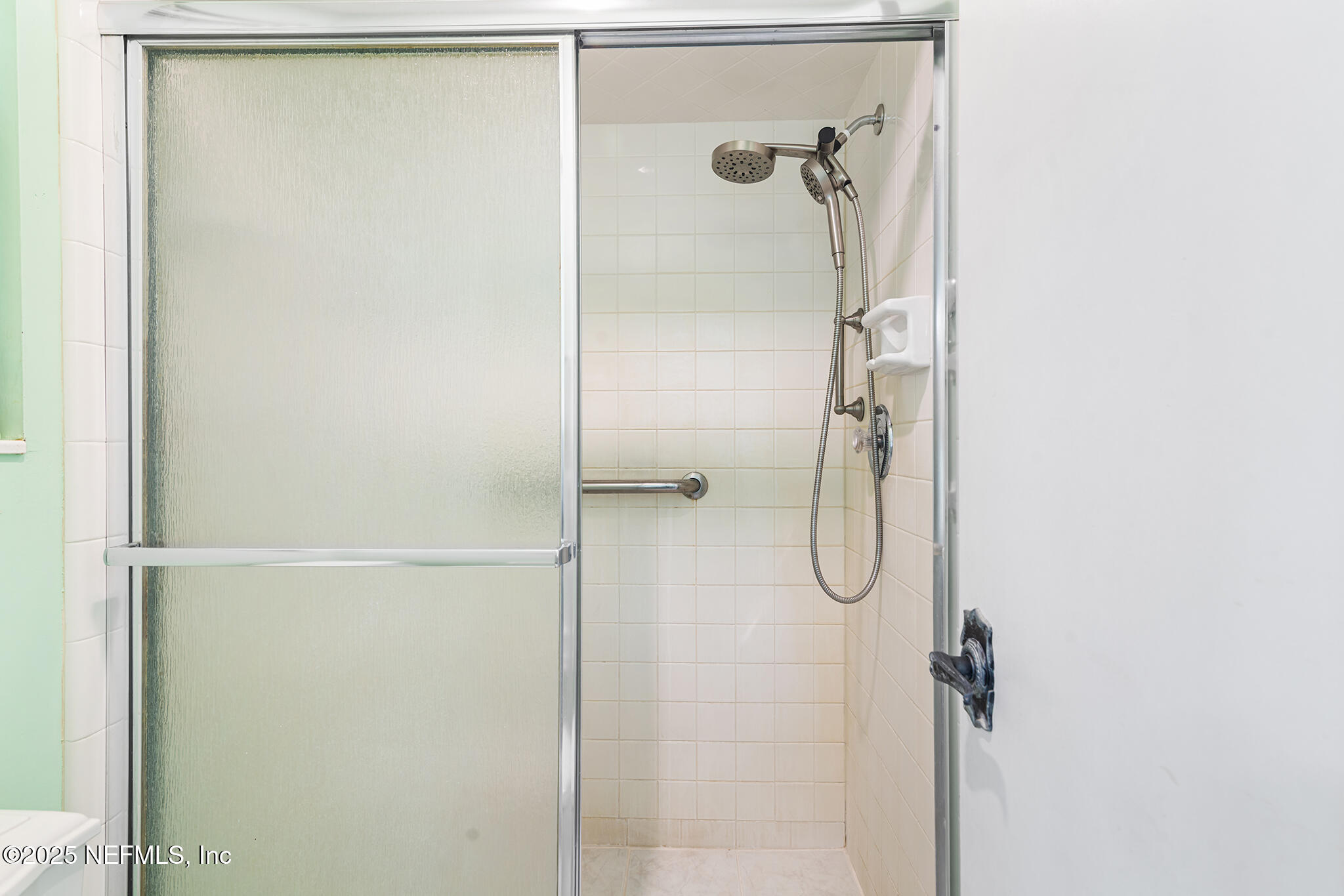 12850 Deep Lagoon Place West Jacksonville, FL 32246 - Photo 38 of 51 a bathroom with a glass shower door