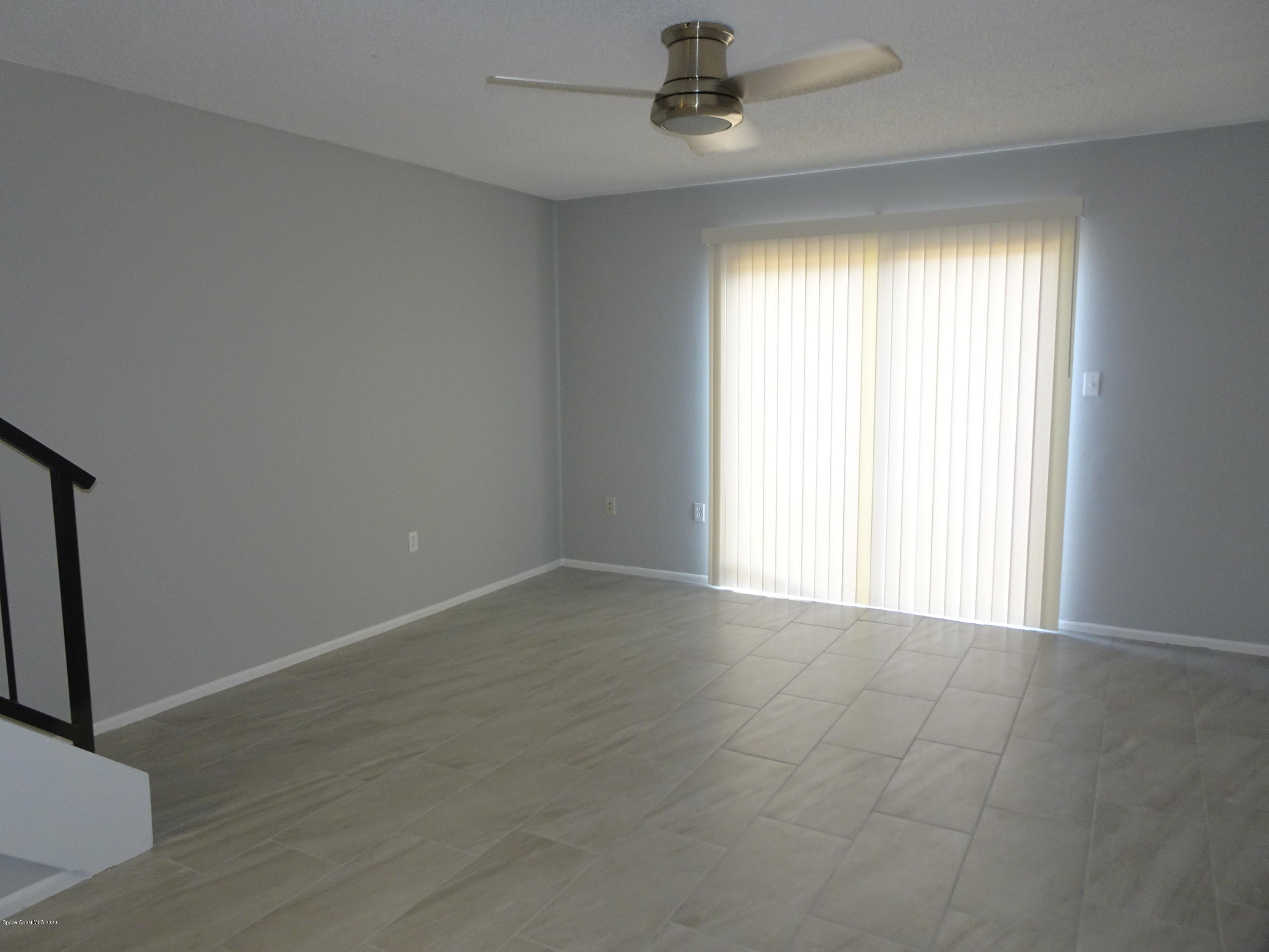 4875 Sisson Road Titusville, FL 32780 - Photo 4 of 14 an empty room with a window