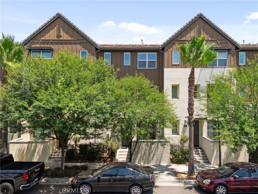 a view of multiple houses with a street