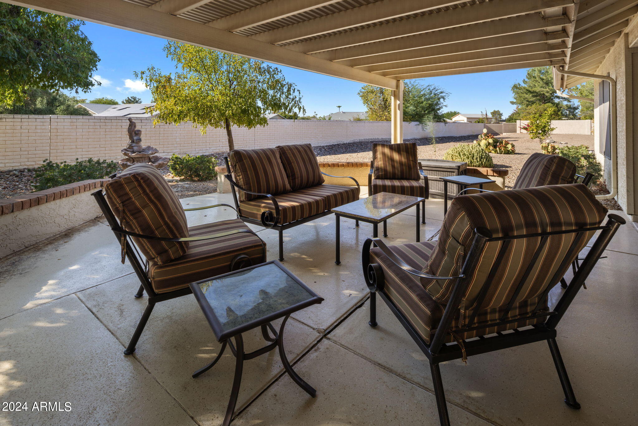 9856 West Rimrock Drive Peoria, AZ 85382 - Photo 12 of 37 a view of chairs and tables in the patio