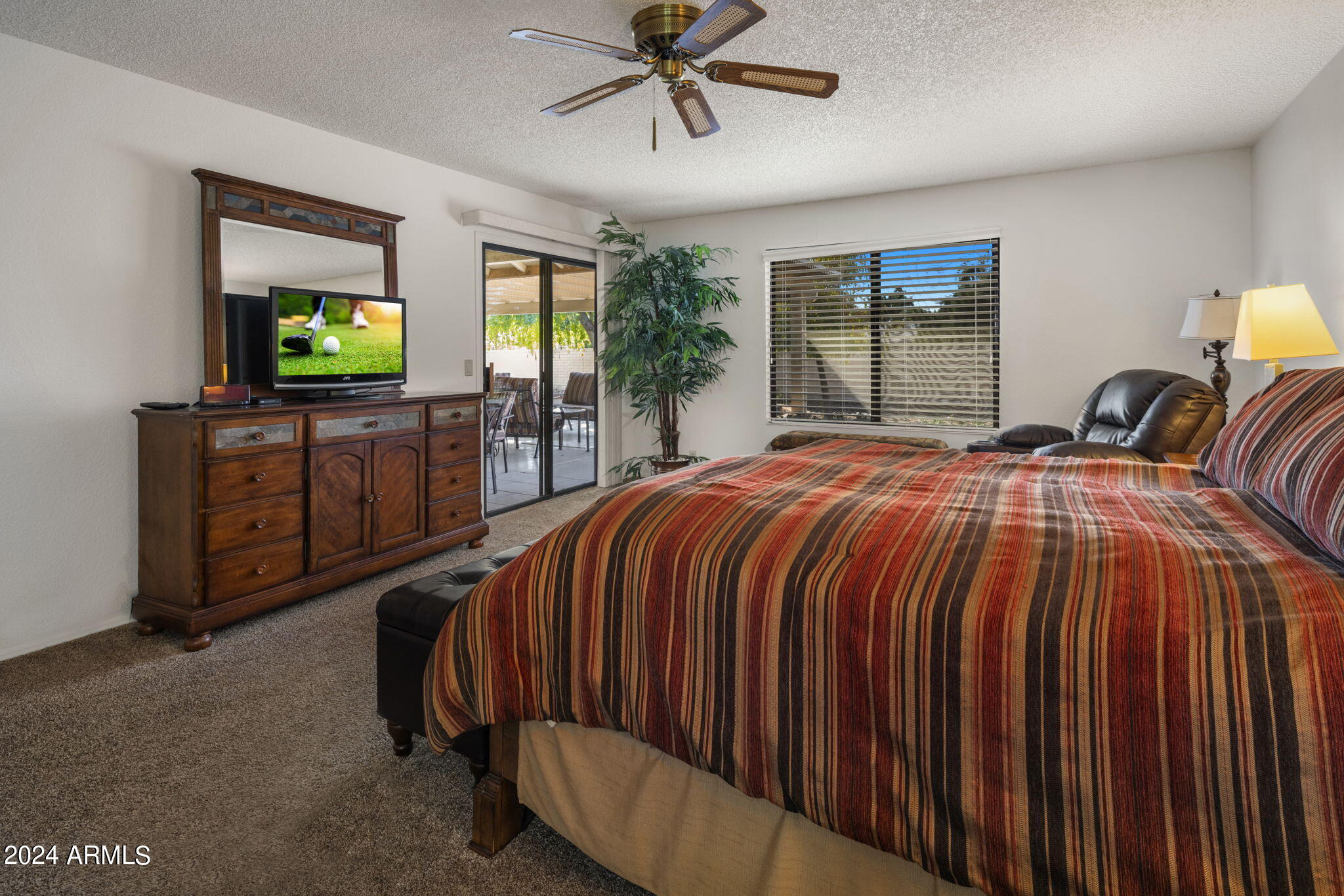 9856 West Rimrock Drive Peoria, AZ 85382 - Photo 27 of 37 a bedroom with a bed and a television