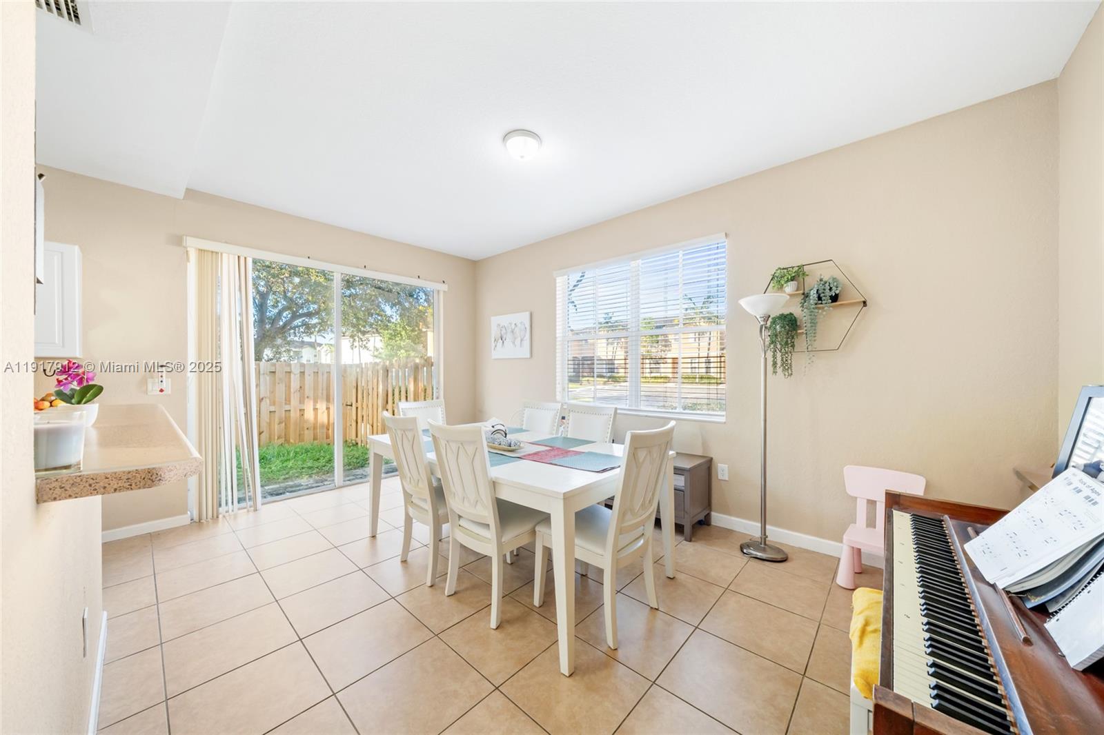 152 Southeast 29th Avenue, Unit 9 Homestead, FL 33033 - Photo 6 of 26 a dining room with furniture and window