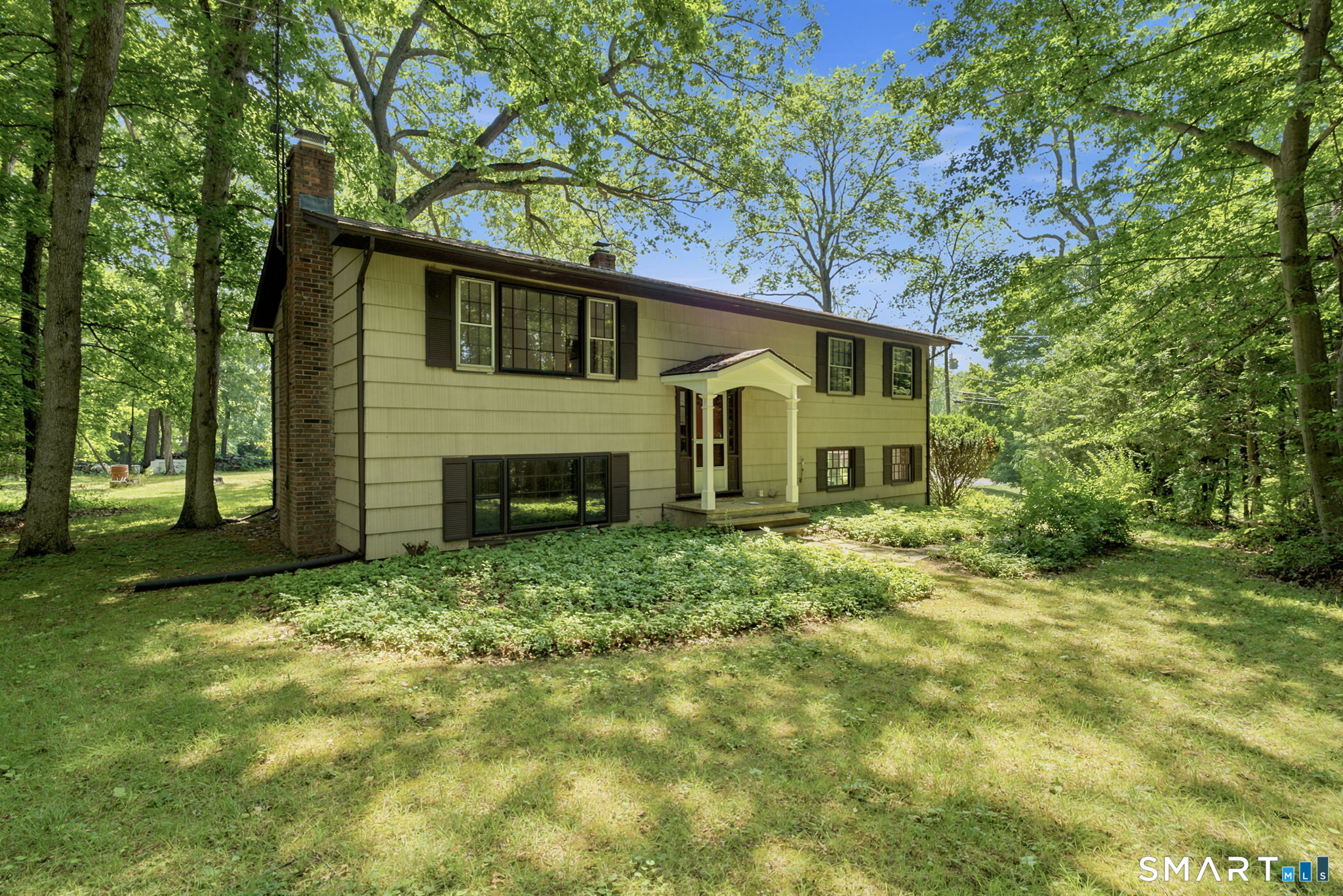 448 Mixville Road Cheshire, CT 06410 - Photo 28 of 32 a house view with a garden space
