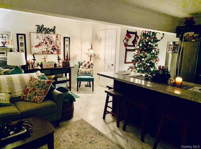 a bedroom with a bed a table and dresser