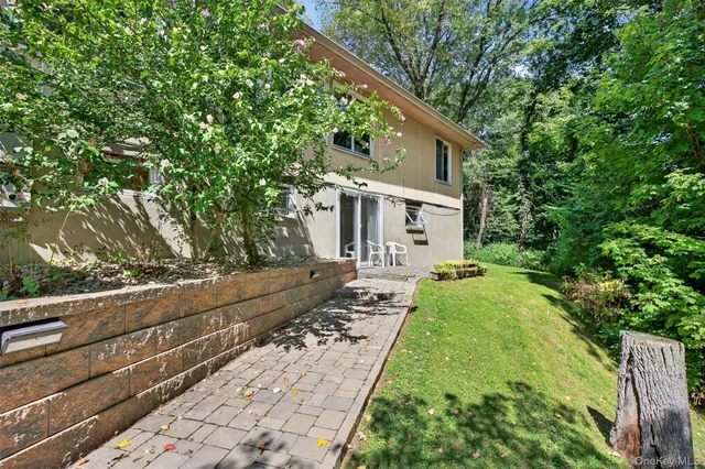a view of house with yard