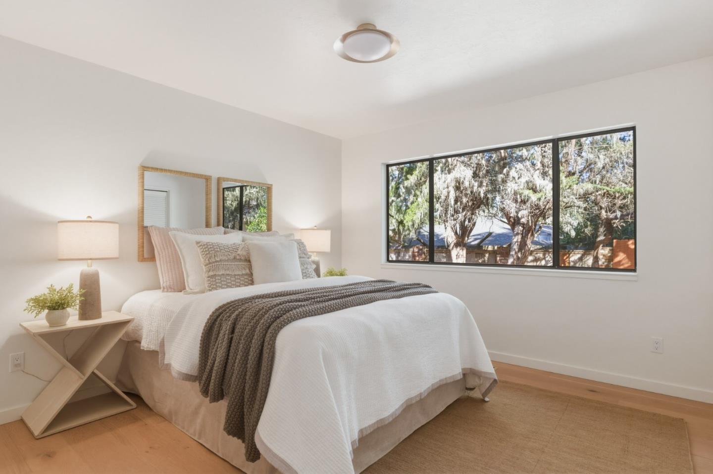 1171 Chaparral Road Pebble Beach, CA 93953 - Photo 11 of 20 a bed room with a bed and a large window