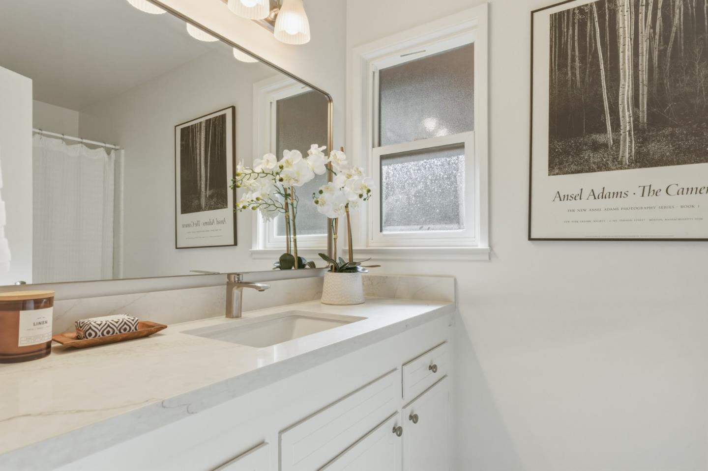 1171 Chaparral Road Pebble Beach, CA 93953 - Photo 12 of 20 a bathroom with a sink and a mirror