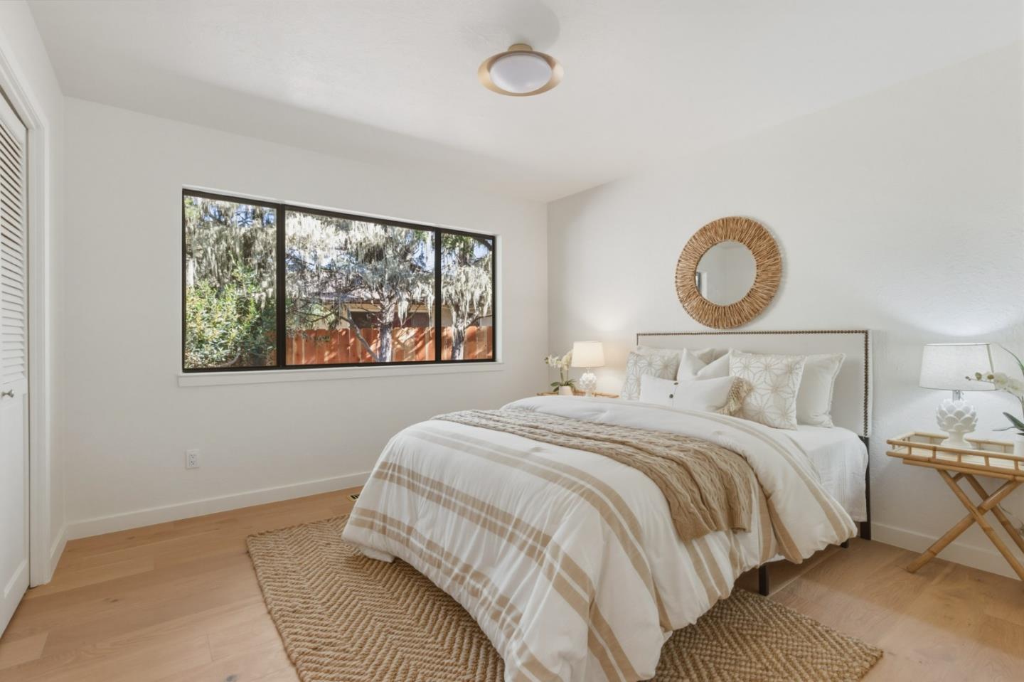 1171 Chaparral Road Pebble Beach, CA 93953 - Photo 13 of 20 a bedroom with a bed and a window