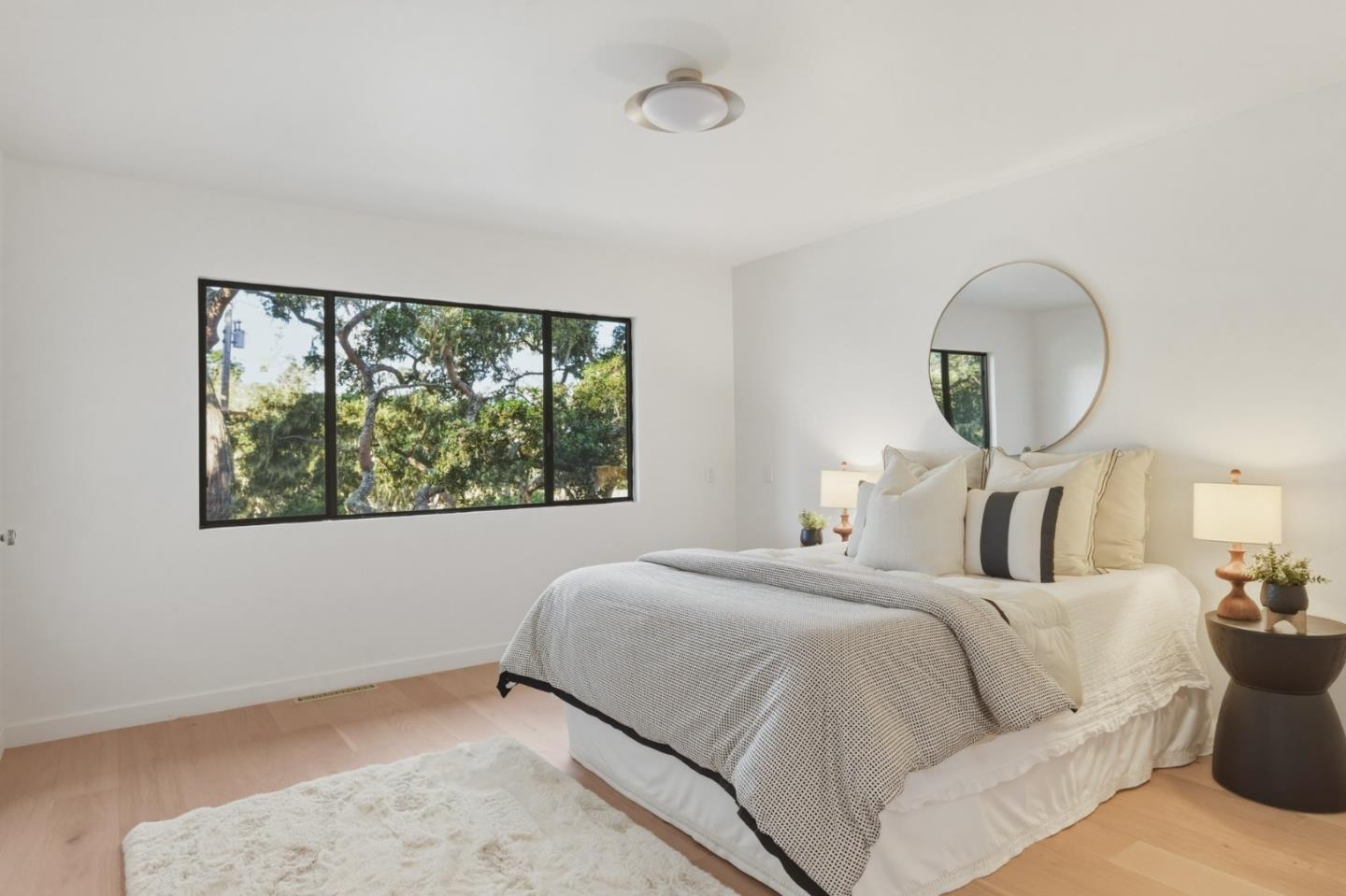1171 Chaparral Road Pebble Beach, CA 93953 - Photo 19 of 20 a bedroom with a large bed and a window