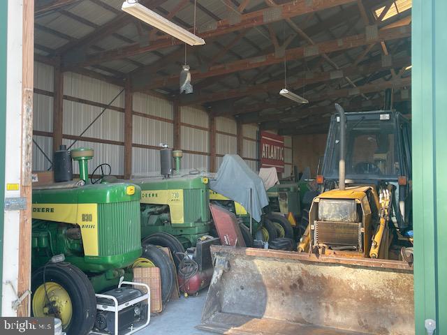 6794 Bent Pine Road Willards, MD 21874 - Photo 20 of 29 a living room with furniture and a fireplace
