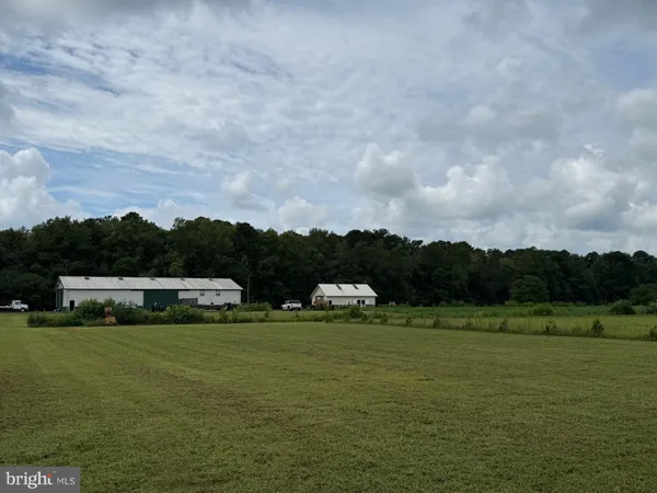 a view of lawn chairs and an ocean view