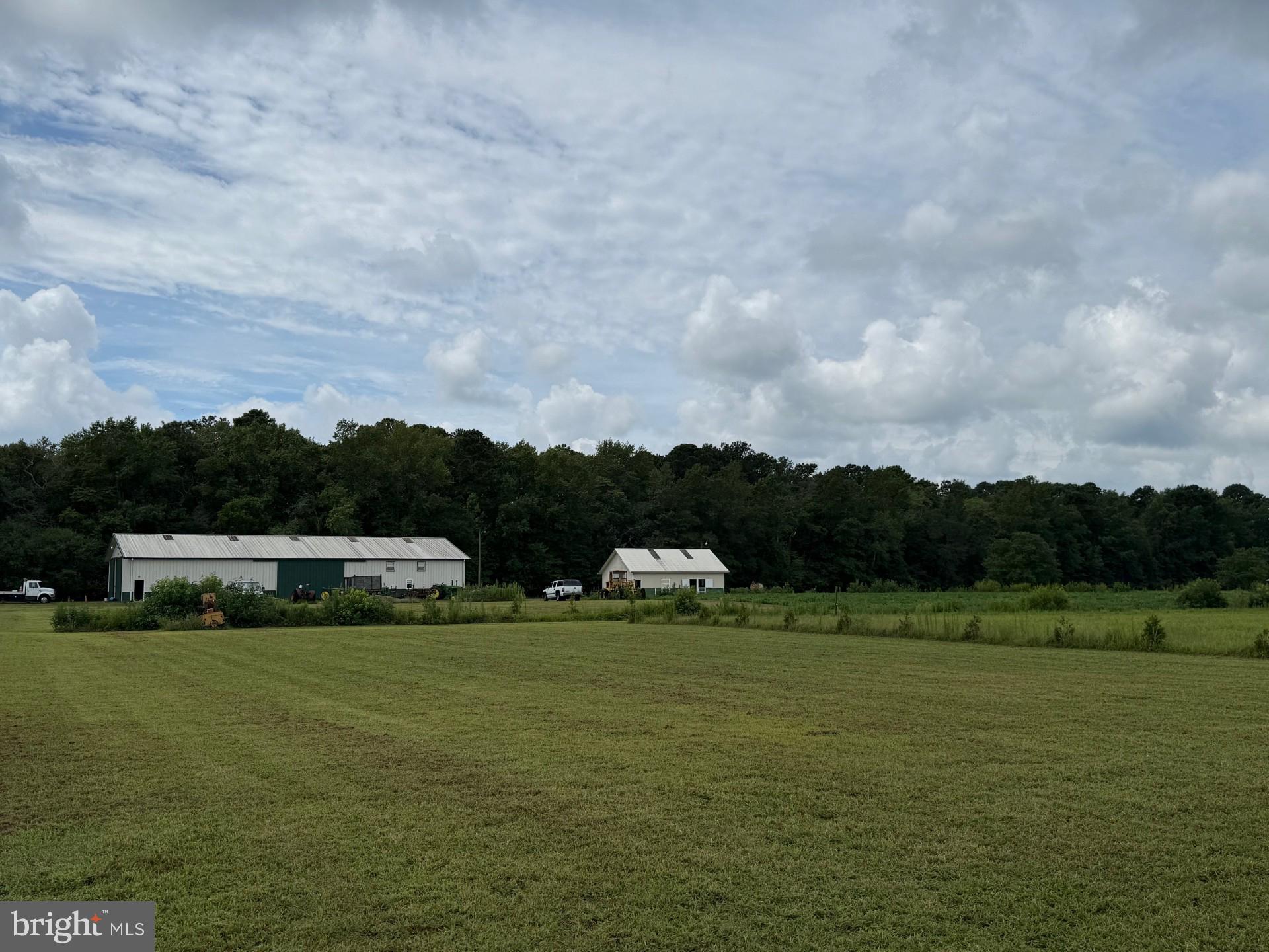 6794 Bent Pine Road Willards, MD 21874 - Photo 2 of 29 a view of lawn chairs and an ocean view