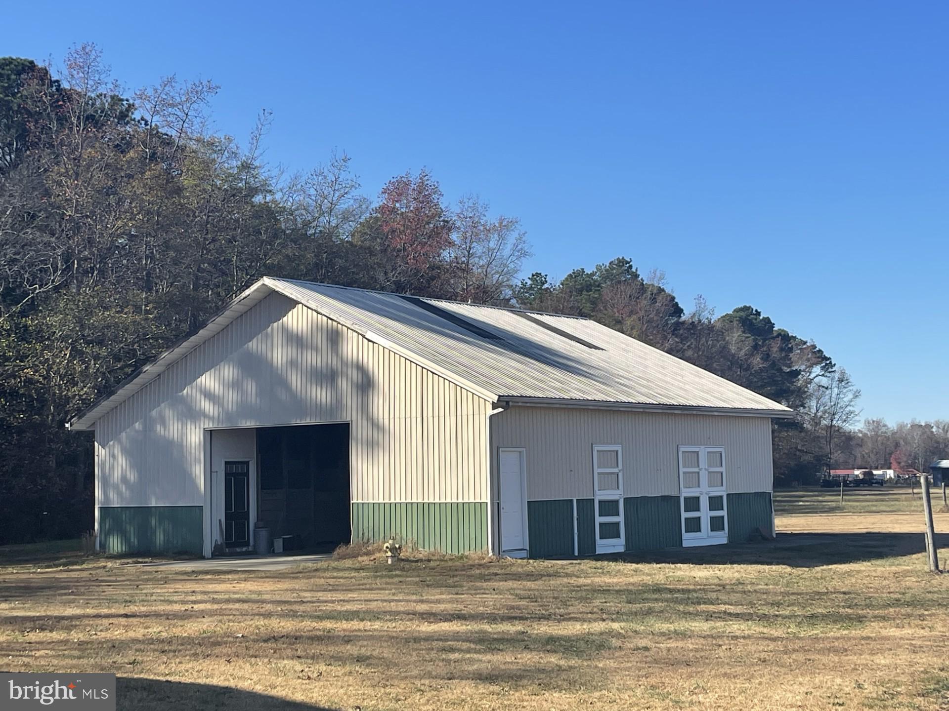 6794 Bent Pine Road Willards, MD 21874 - Photo 4 of 29 a view of a house with a swimming pool and sitting area