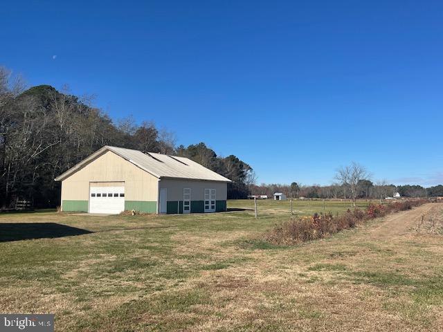 6794 Bent Pine Road Willards, MD 21874 - Photo 10 of 29 a view of a large house with a big yard and large tree