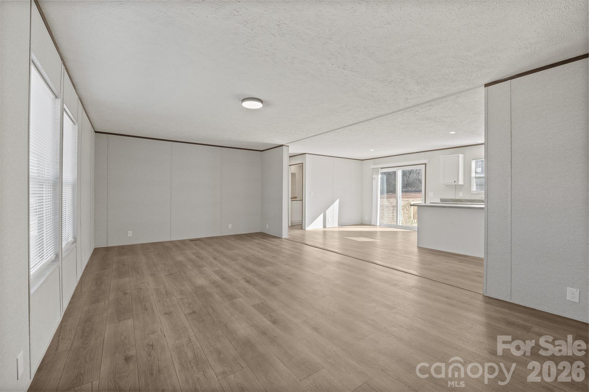 3613 Jamestown Road Morganton, NC 28655 - Photo 11 of 30 a view of empty room with wooden floor and window