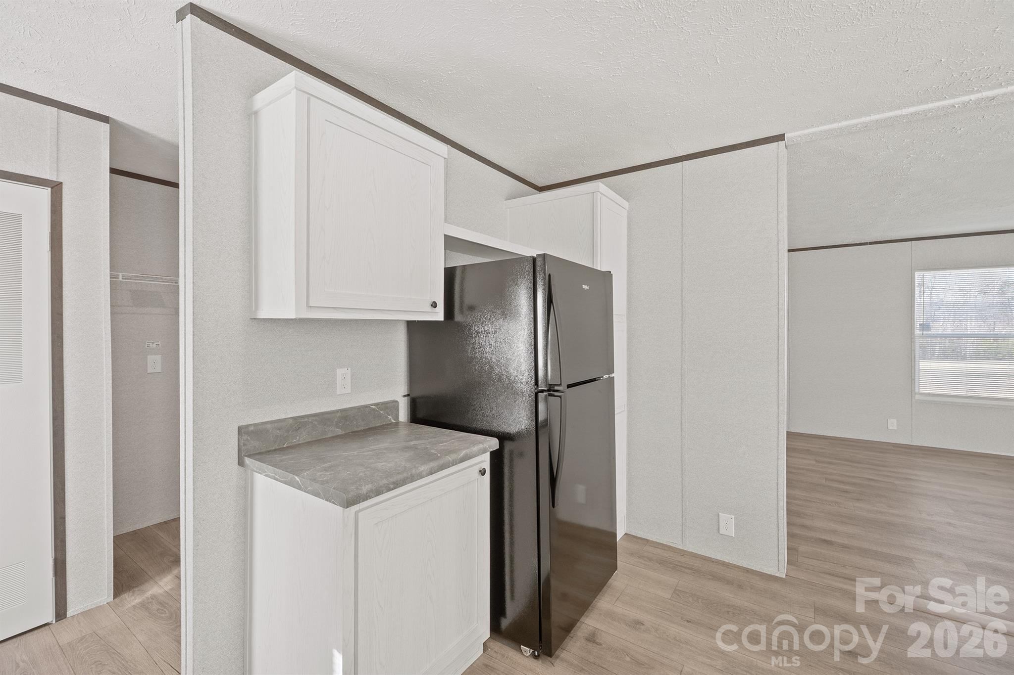 3613 Jamestown Road Morganton, NC 28655 - Photo 18 of 30 a kitchen with stainless steel appliances granite countertop a refrigerator and a stove top oven