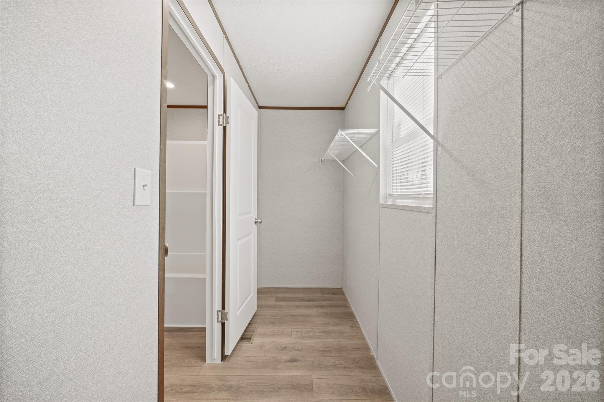 3613 Jamestown Road Morganton, NC 28655 - Photo 25 of 30 a view of a hallway with wooden floor and entryway