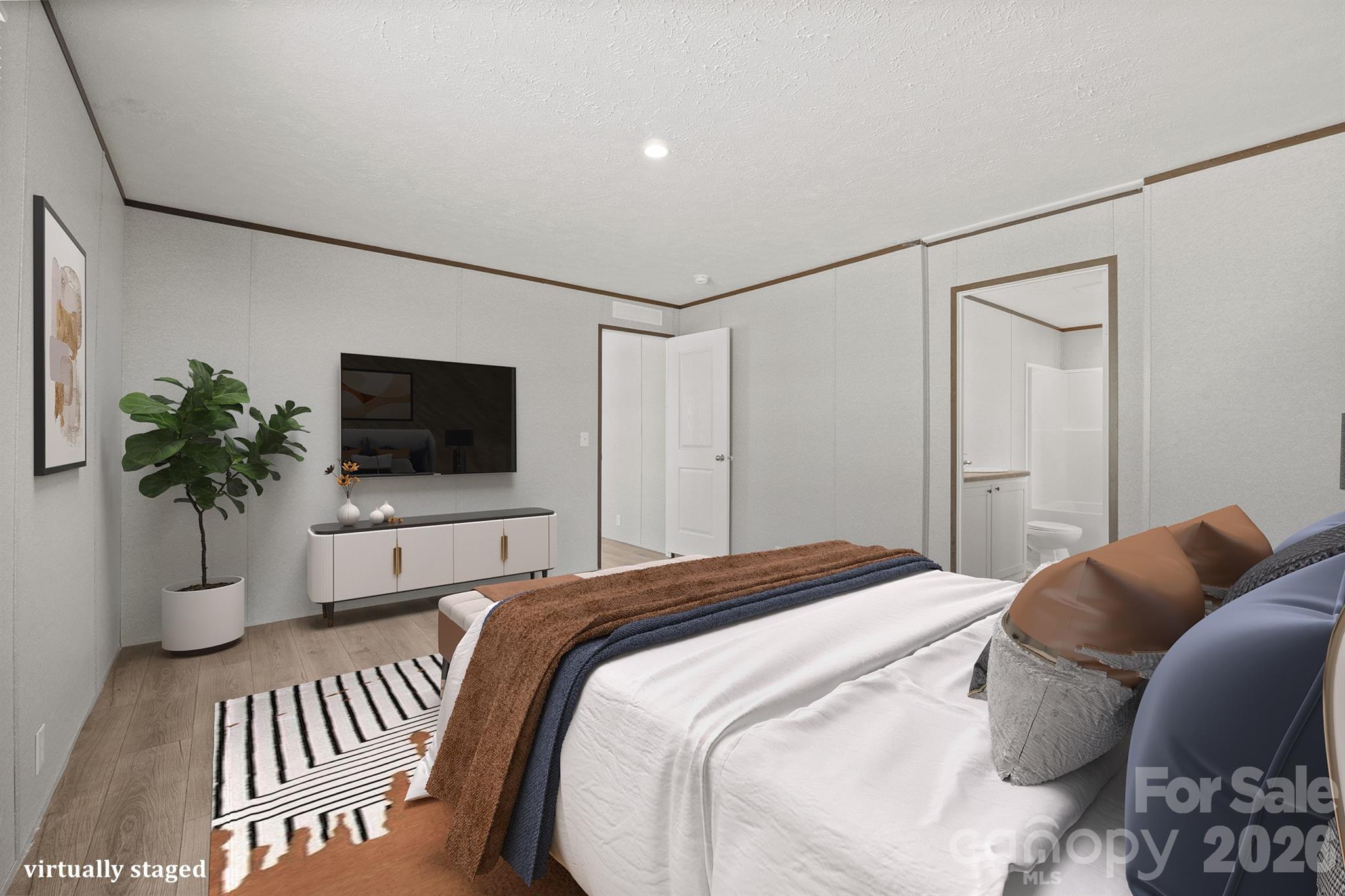 3613 Jamestown Road Morganton, NC 28655 - Photo 26 of 30 a bedroom with a bed and a flat screen tv