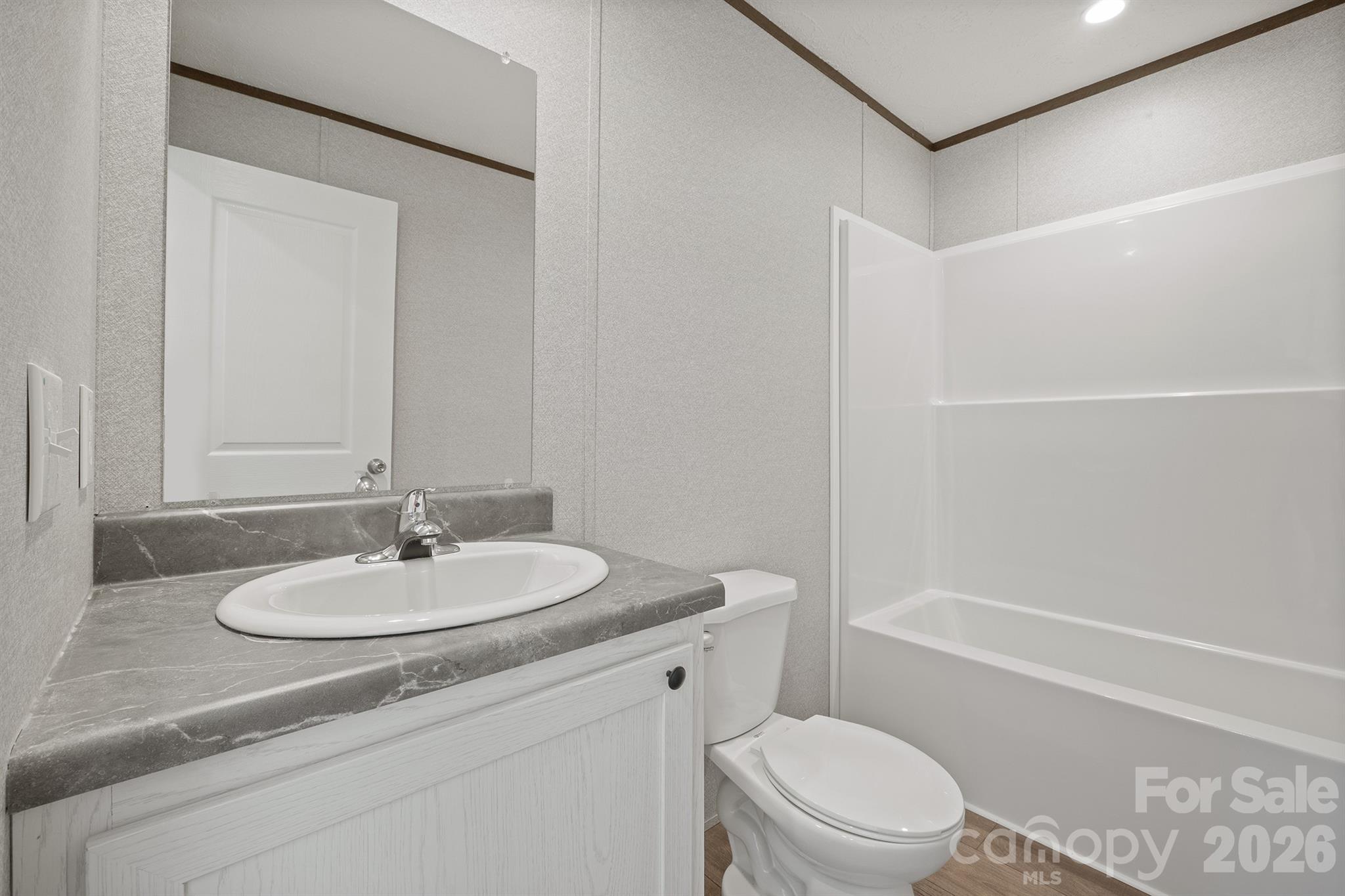 3613 Jamestown Road Morganton, NC 28655 - Photo 28 of 30 a bathroom with a sink a toilet and shower