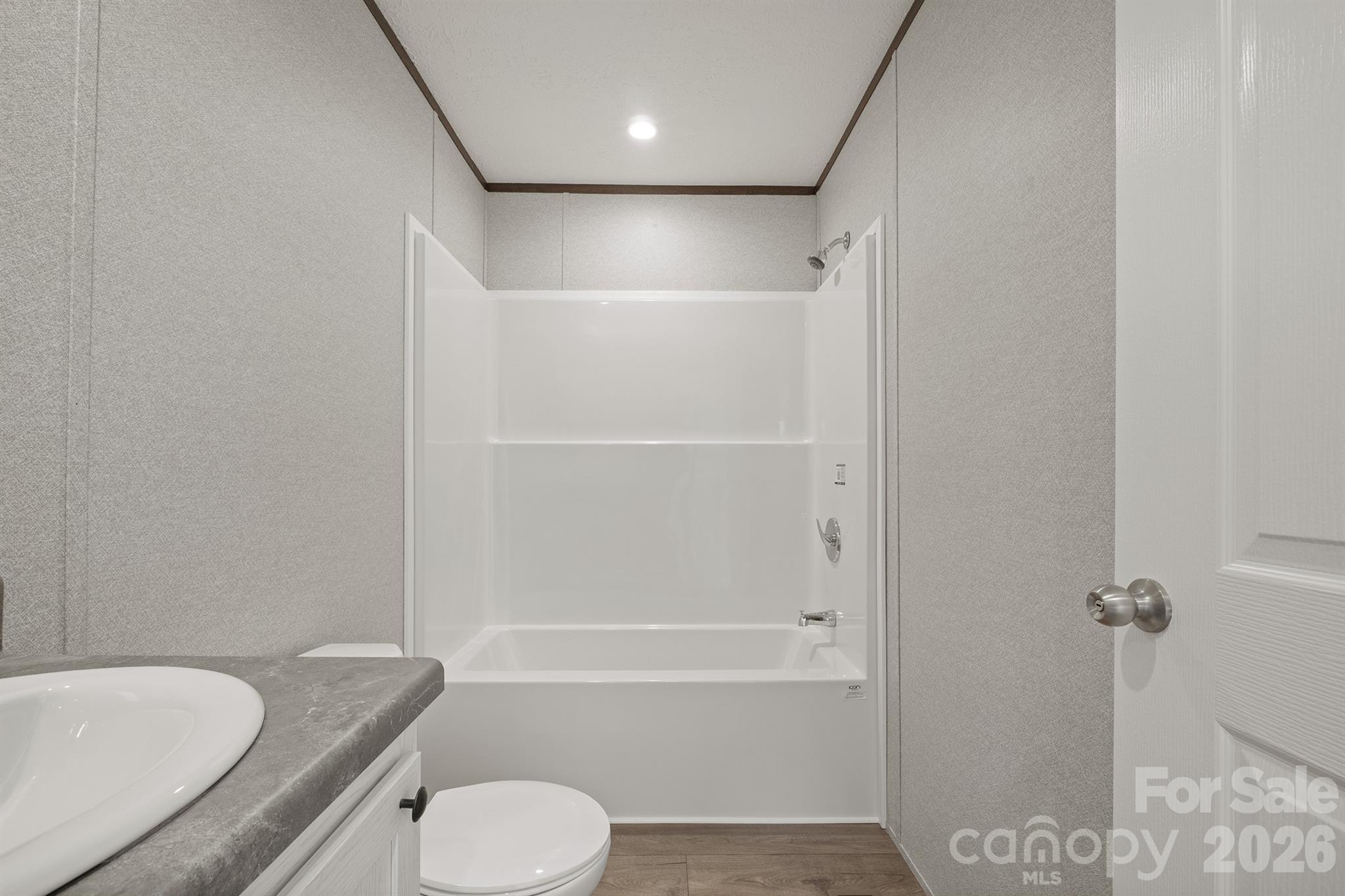 3613 Jamestown Road Morganton, NC 28655 - Photo 29 of 30 a bathroom with a toilet and a tub