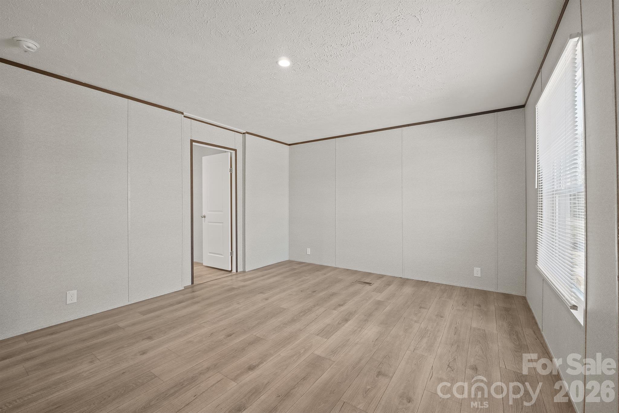 3613 Jamestown Road Morganton, NC 28655 - Photo 30 of 30 an empty room with wooden floor and windows