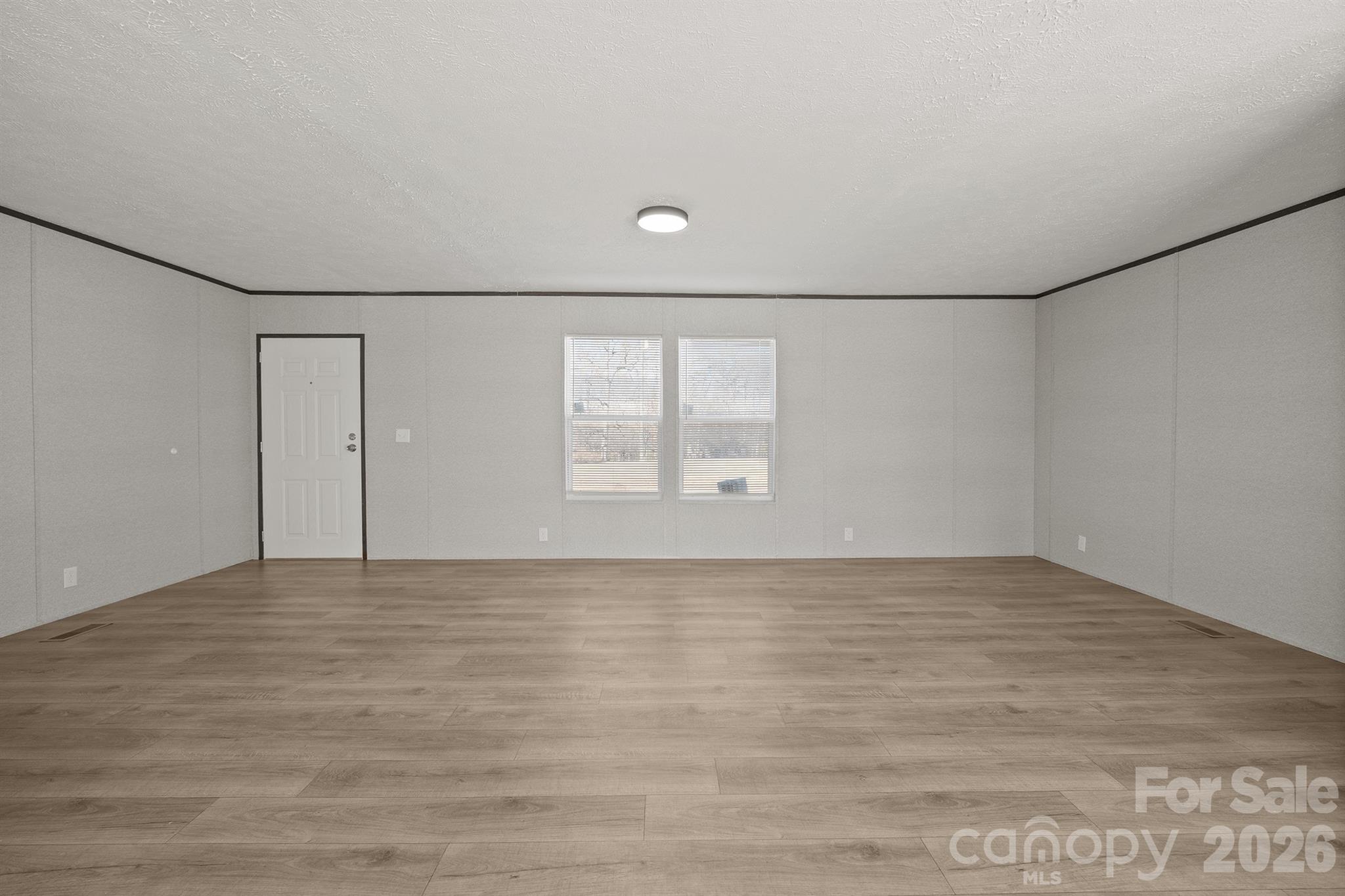 3613 Jamestown Road Morganton, NC 28655 - Photo 9 of 30 a view of an empty room with a window