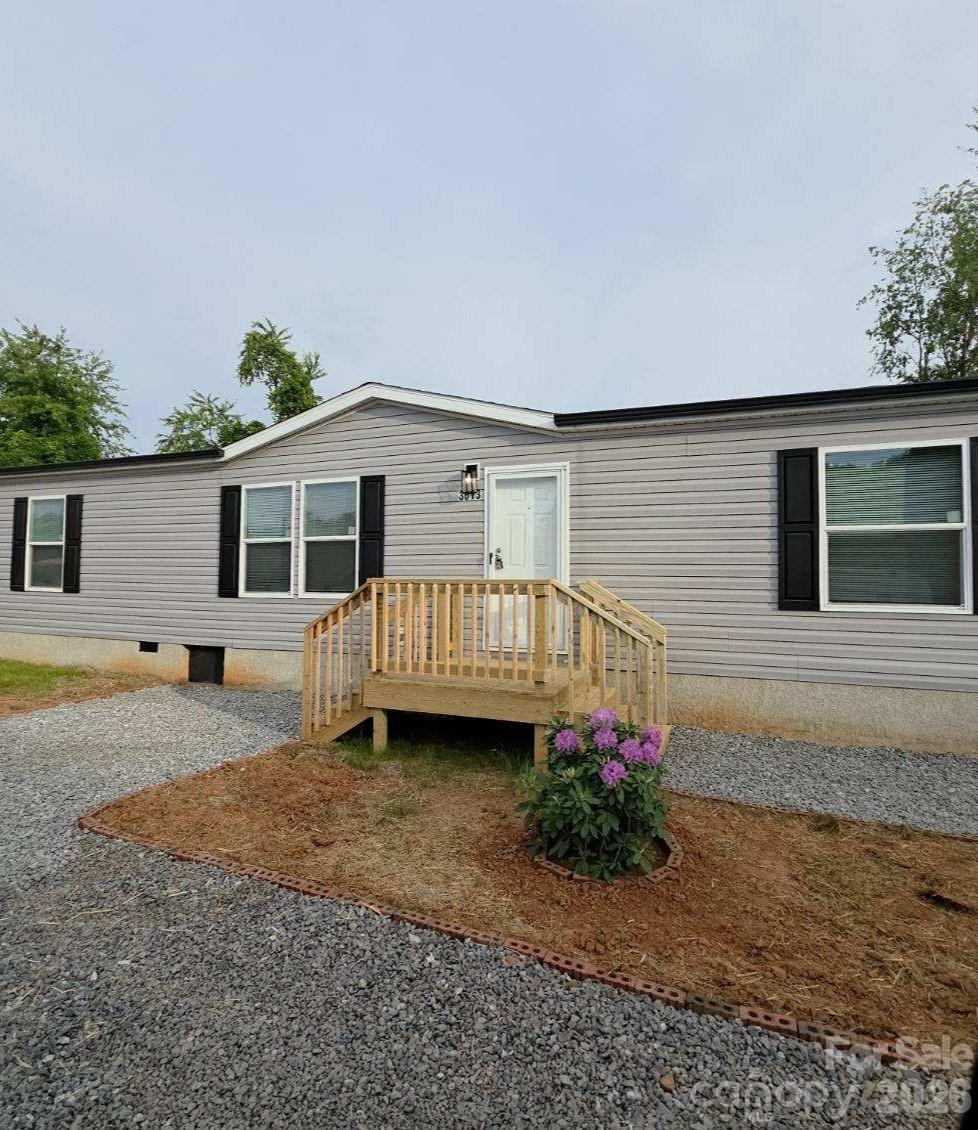 3613 Jamestown Road Morganton, NC 28655 - Photo 10 of 30 a view of a house with wooden floor and a yard