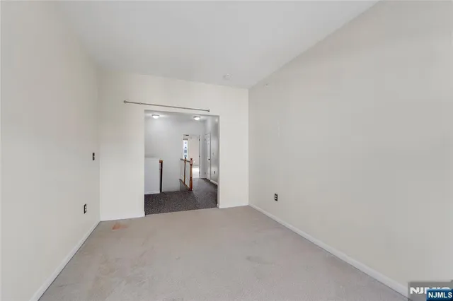 a view of a big room with closet and chandelier fan