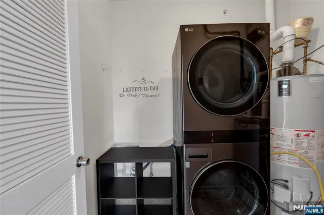 a view of a hallway with washer and dryer