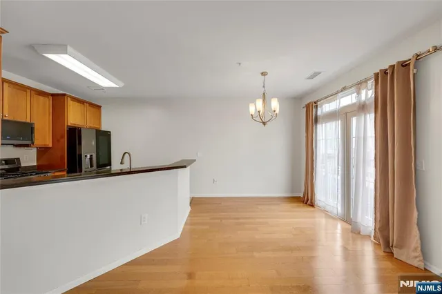 a view of kitchen and wooden floor