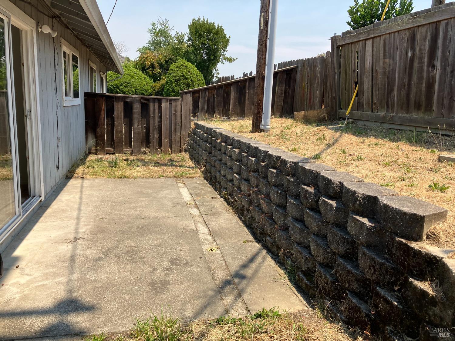 Sereno Drive Vallejo, CA 94589 - Photo 10 of 20 a view of backyard space with wooden fence