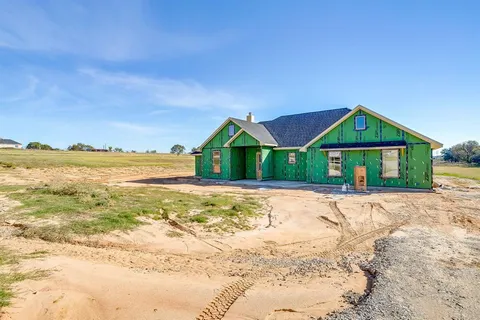 a house with trees in front of it