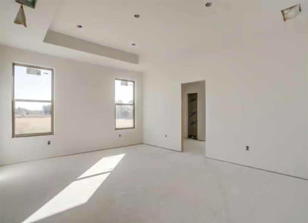 117 Clare Road Poolville, TX 76487 - Photo 5 of 5 a view of an empty room with a window