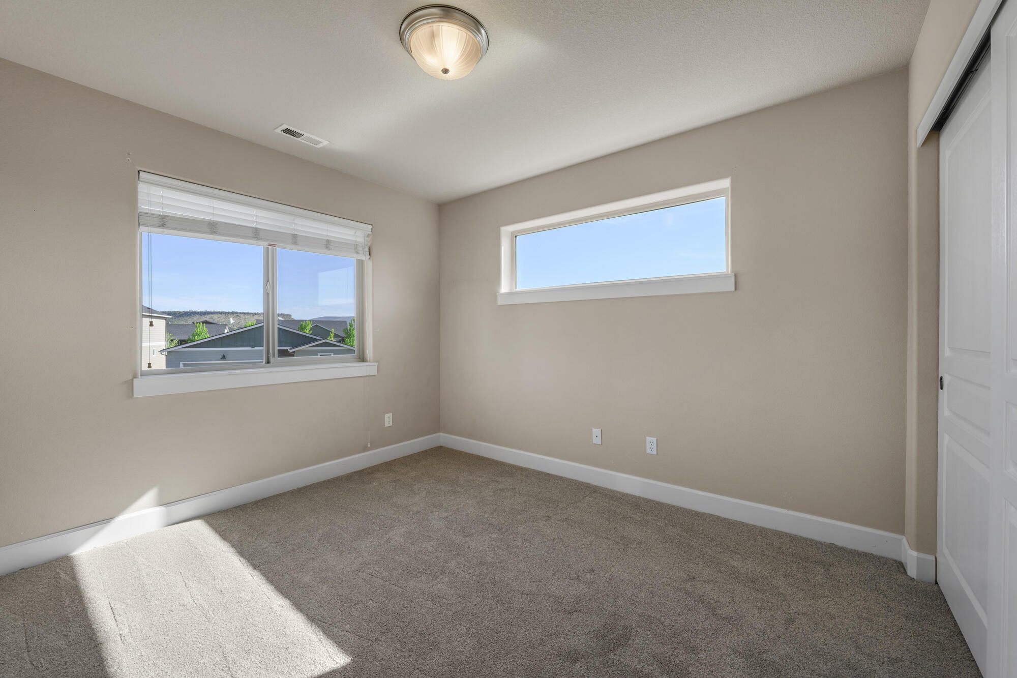 1402 Northeast Hudspeth Road Prineville, OR 97754 - Photo 24 of 36 an empty room with windows