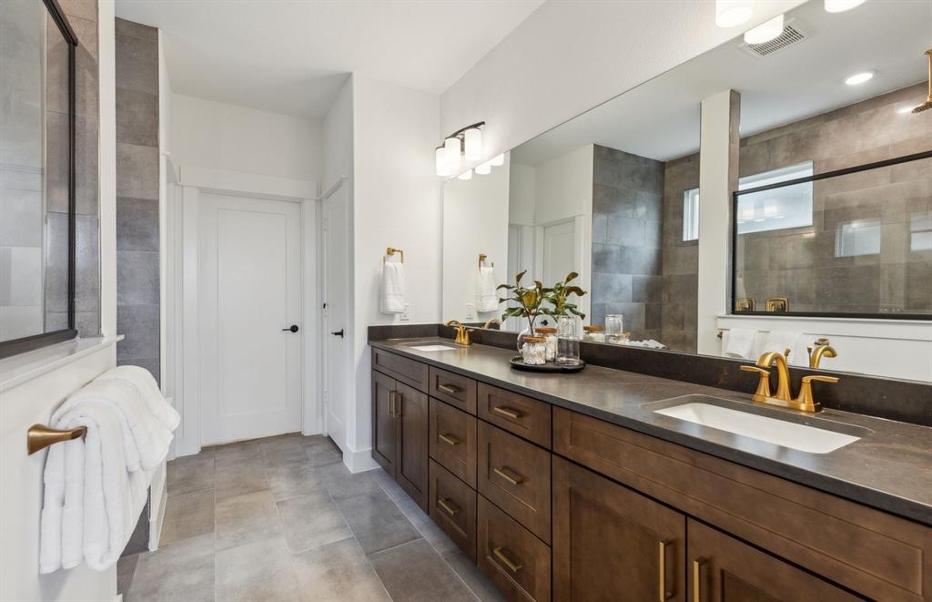 11109 Carham Street Haslet, TX 76052 - Photo 15 of 24 Luxurious owner's bath featuring dual vanities and a deep walk-in shower *Model representation