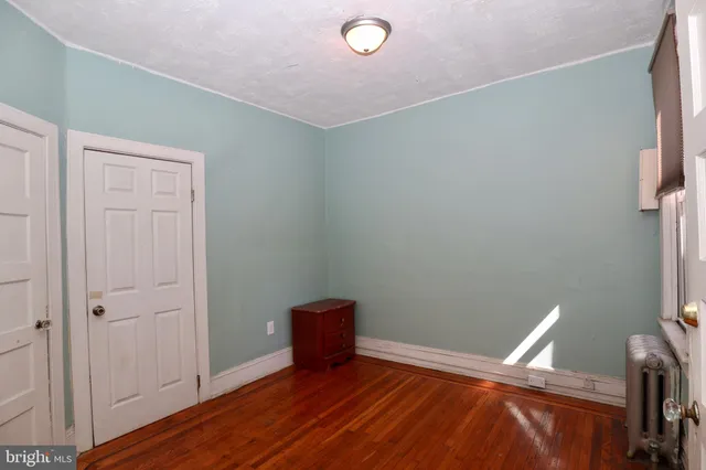 a kitchen with windows and refrigerator