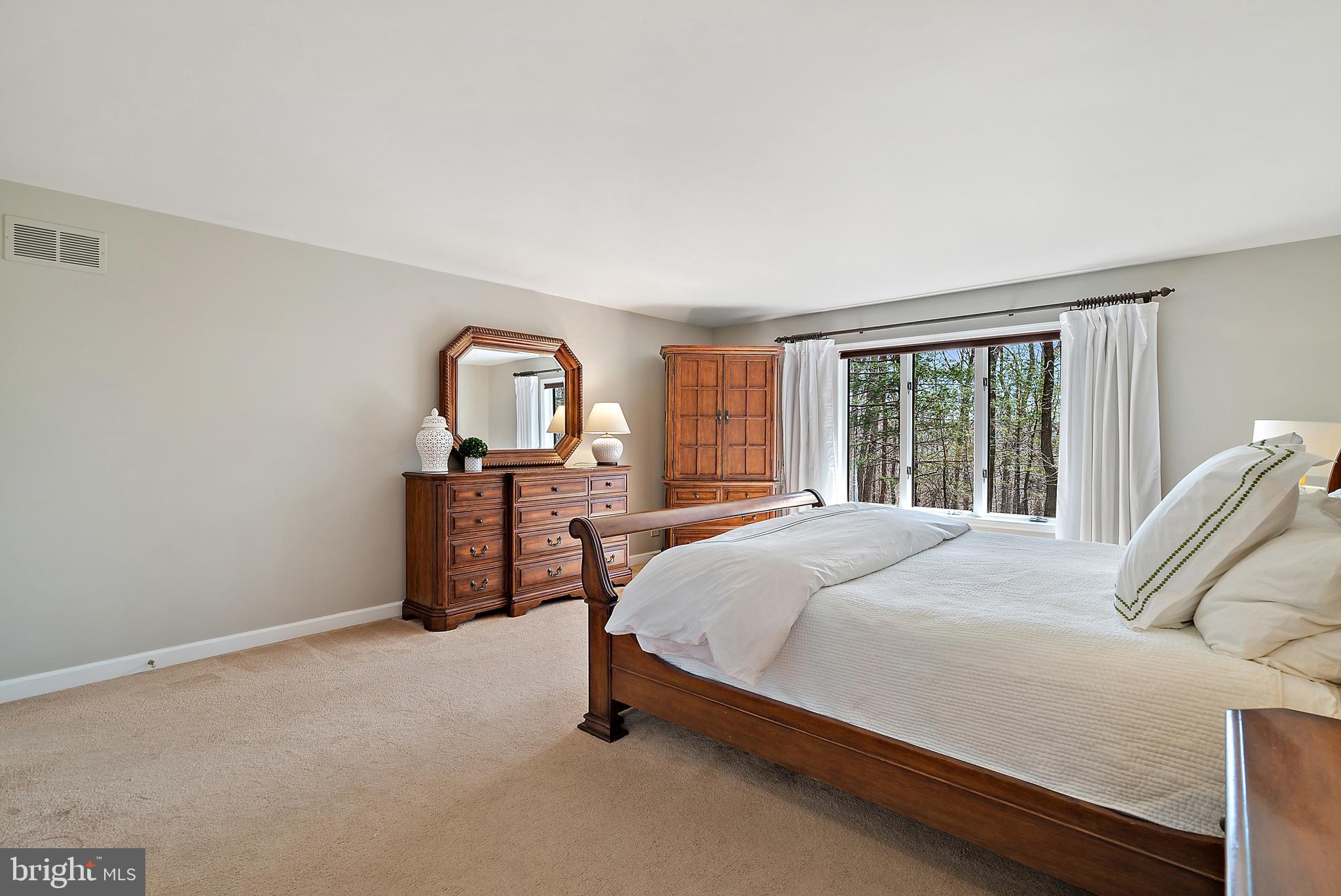 6709 Wilson Road Marshall, VA 20115 - Photo 22 of 34 a bed sitting in a spacious bedroom next to a window